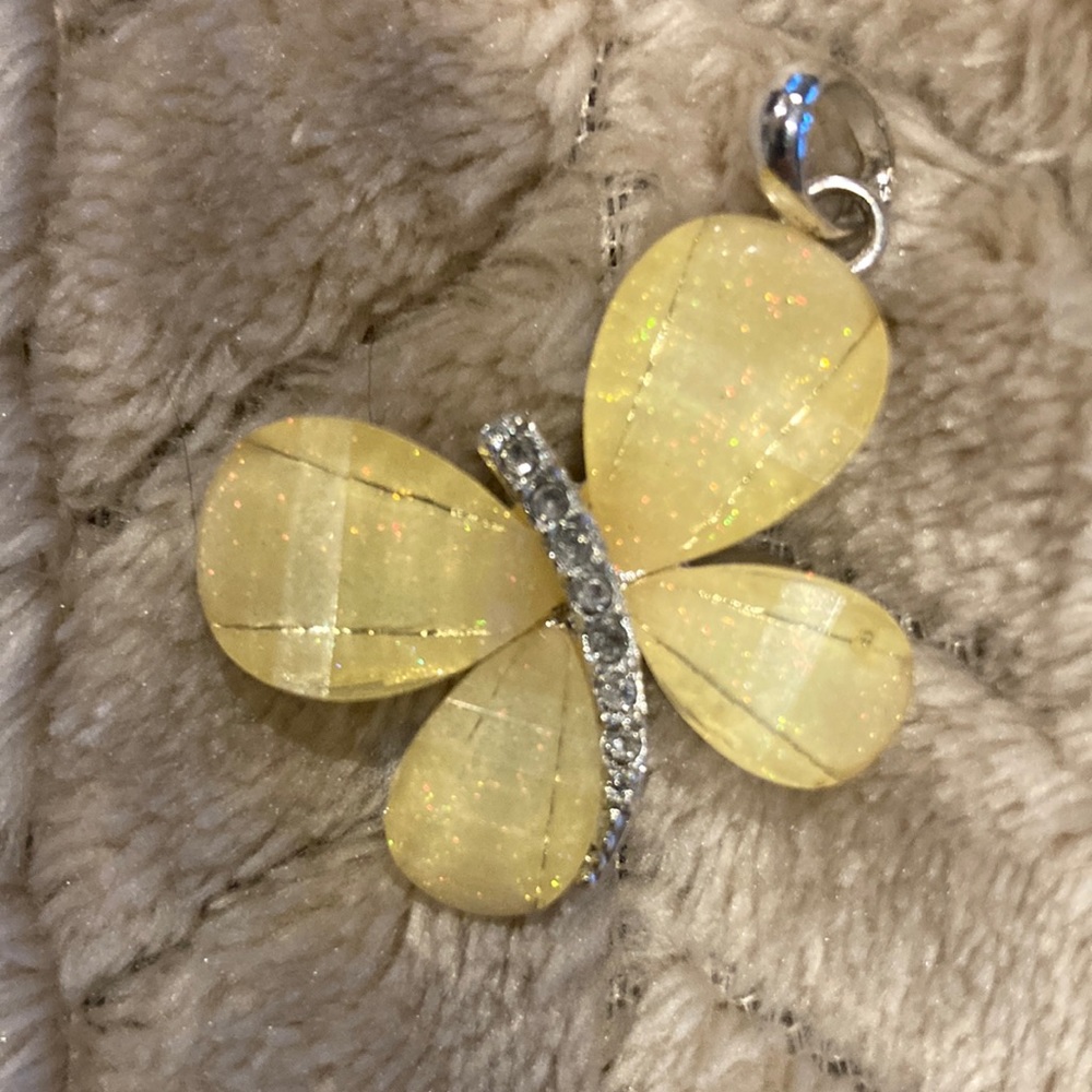Girls Yellow Butterfly and petite cross pendants. 1 x 1 inch. NEW / Unused.